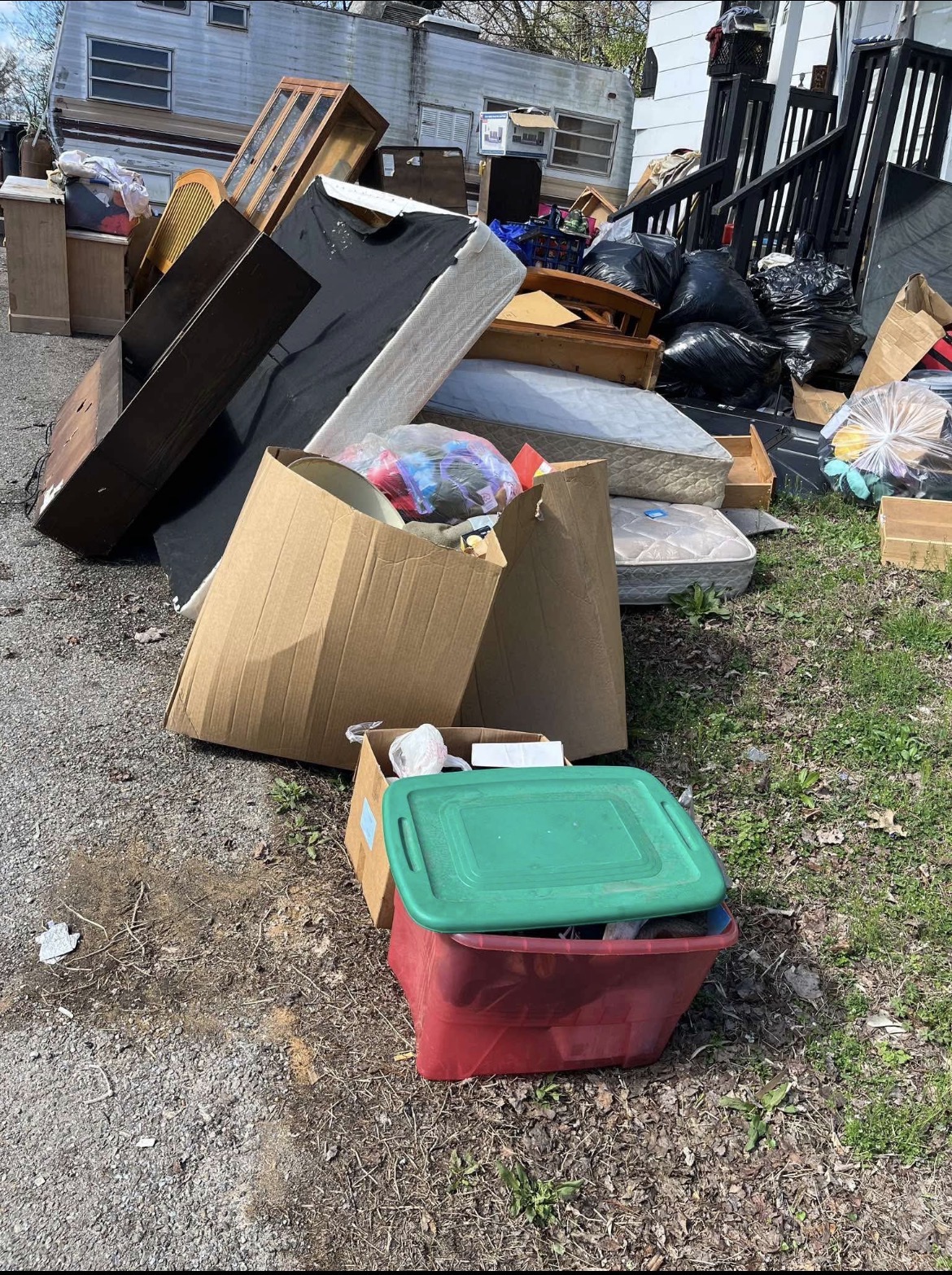 Furniture mattresses boxes and bags ready for junk removal