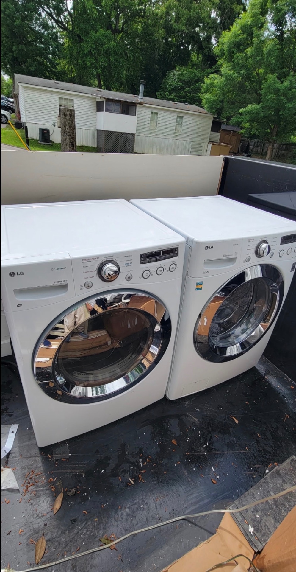 Washer and dryer appliance removal loaded for hauling